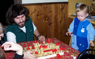 Father building Spanish castle with son.